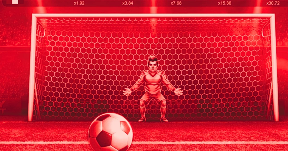 Interface du jeu Penalty Shoot-Out sur un casino en ligne, montrant un gardien de but devant les cages avec un ballon au premier plan, des multiplicateurs affichés en haut 1.92x, 3.84x, 7.68x, 15.36x et 30.72x, mise en mode démo DEM 10.00 en bas à gauche, et une balance de DEM 5,000.00 affichée, avec un bouton Play central prêt à lancer le tir.